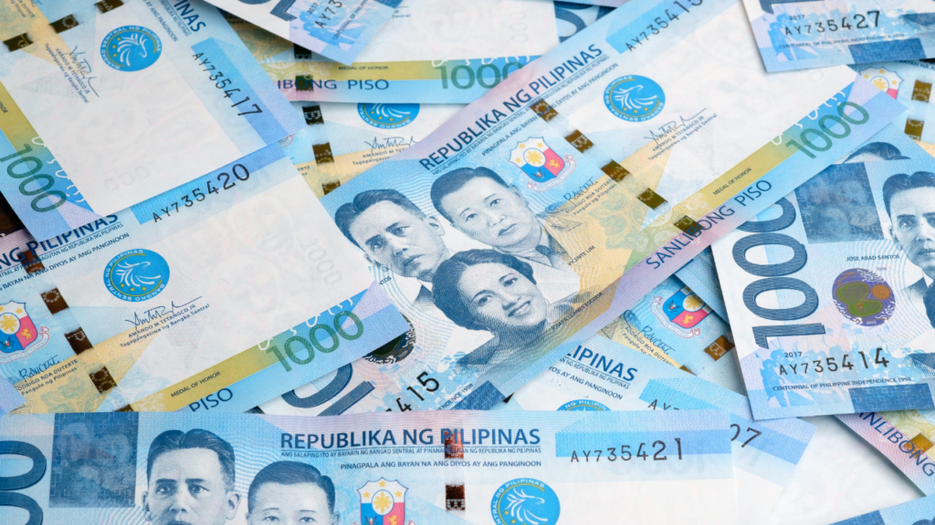 A stock photo of Philippine peso bills with the caption - "Despite record national debt and significant budget deficits, the Marcos government wants to establish a sovereign wealth fund."