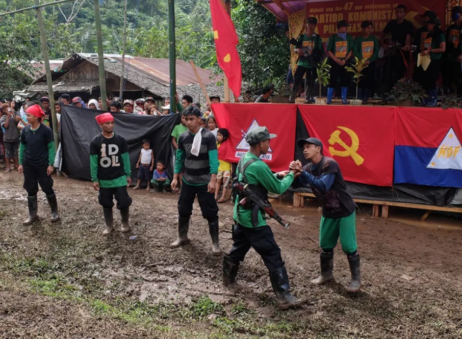 Cadres of the New People's Army (NPA) stage a presentation during an CPP anniversary celebration. (Photo: Raymond Villanueva/Kodao Productions)