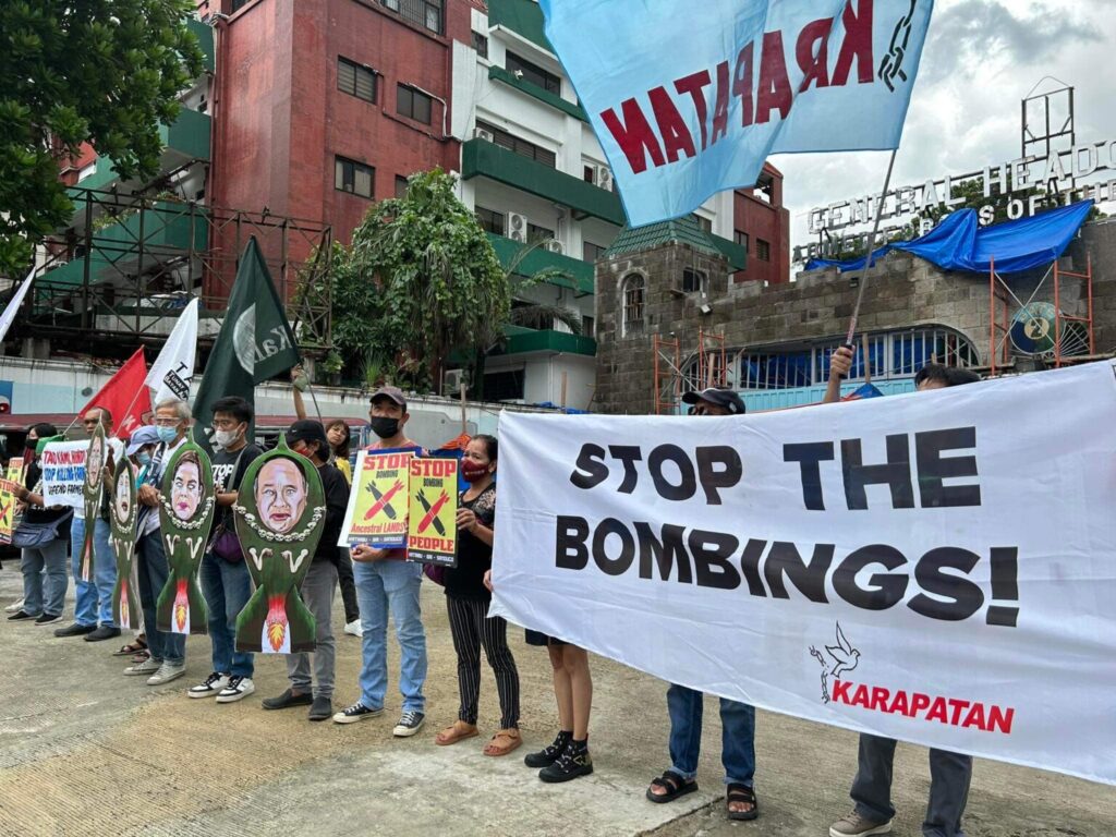 Supporters of the human rights watchdog Karapatan stage a protest against military bombing of civilian communities outside the Armed Forces of the Philippines headquarters in Quezon City in this August 2023 file photo. (Photo: Karapatan.org)