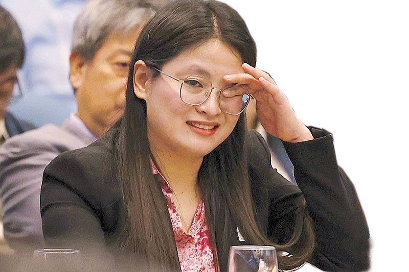 Guo Hua Ping, the mayor of Bamban, Tarlac who posed as a Filipino woman named "Alice Guo", reacts as she faces a Senate inquiry into POGOs. (Photo: Jesse Bustos/Philstar)