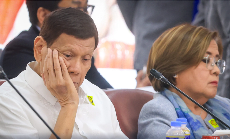 Rodrigo Duterte at the House Quad-Comm hearing on 13 November. He was seated beside his longtime nemesis, former senator Leila de Lima. (Photo: Rappler.com)