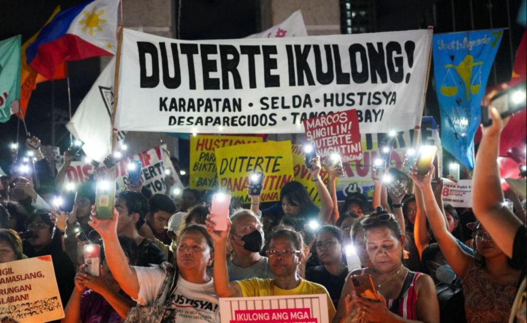 Families of the victims of extrajudicial killings hold a vigil upon hearing of Rodrigo Duterte's arrest and expatriation to The Hague. (Photo: Reuters)